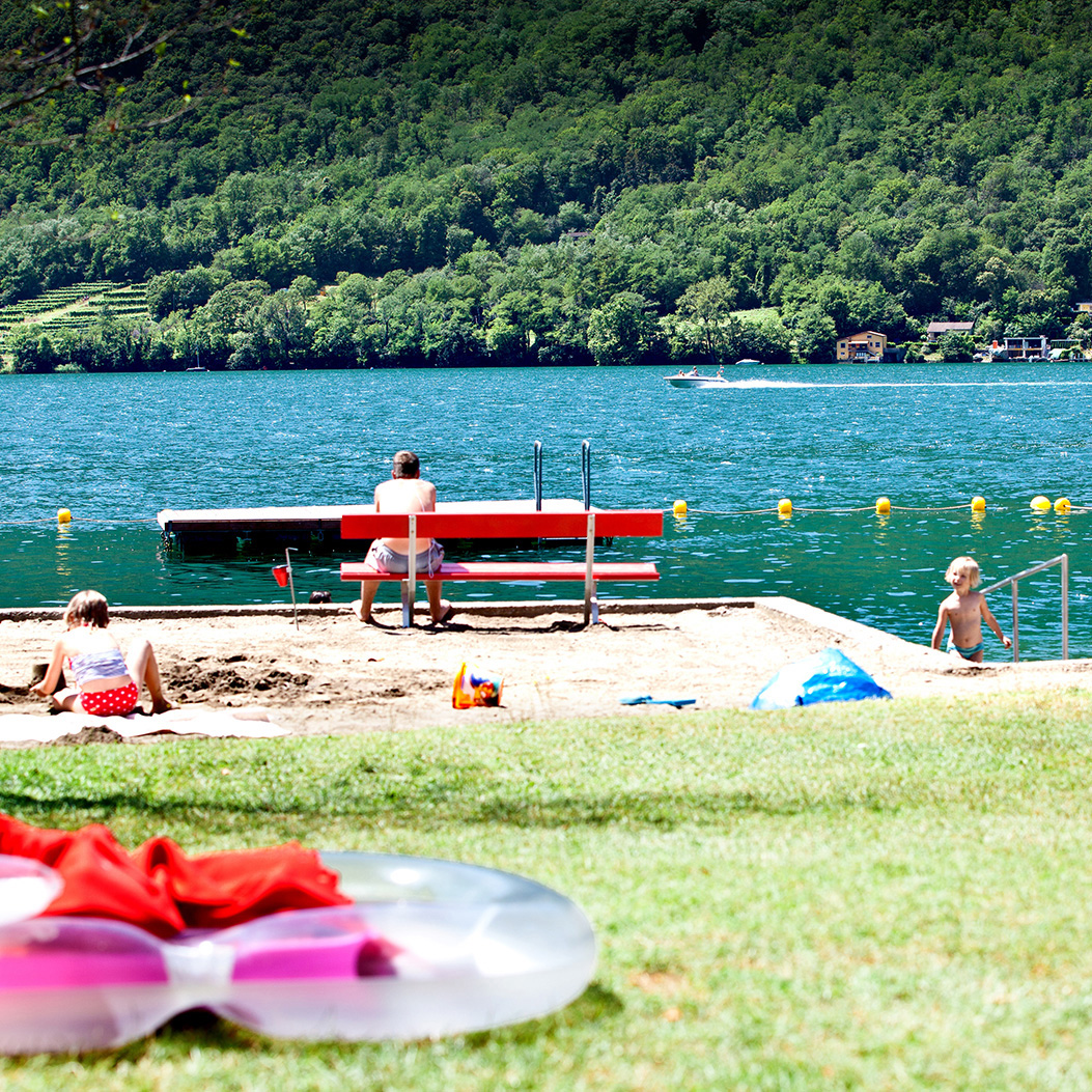 Melano lido. View from the beach towards the lake.