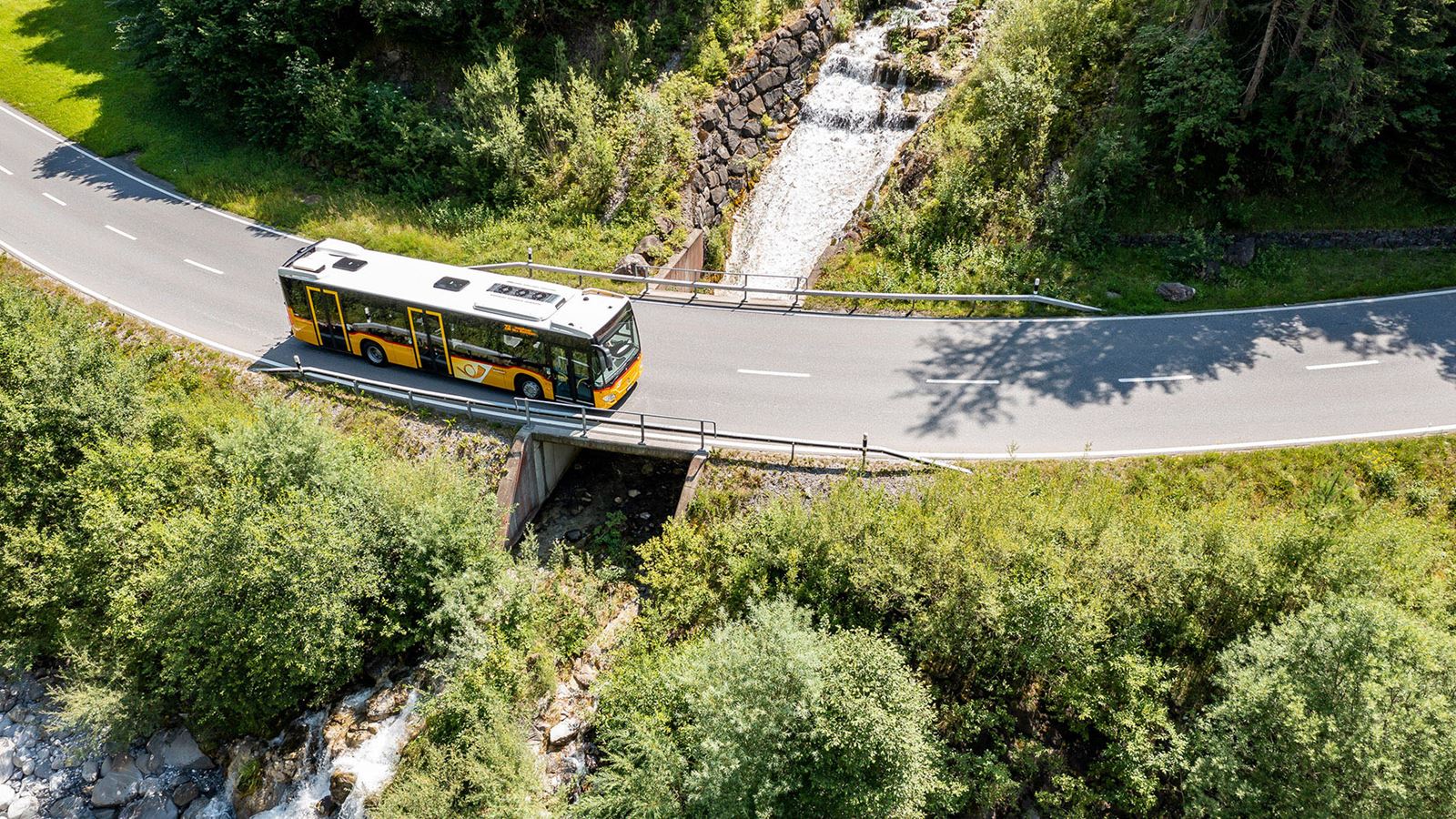 A Postbus on its way through the Diemtigtal Nature Park
