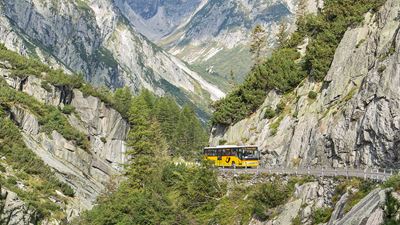 A Postbus travelling on the old Grimsel Pass road from Meiringen towards the Grimsel Pass.