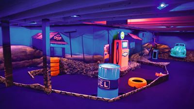 Adventure golf course with neon lights in Actionworld Obfelden