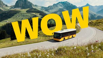 A Postbus driving on a mountainous postal route