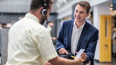 An employee serves a customer