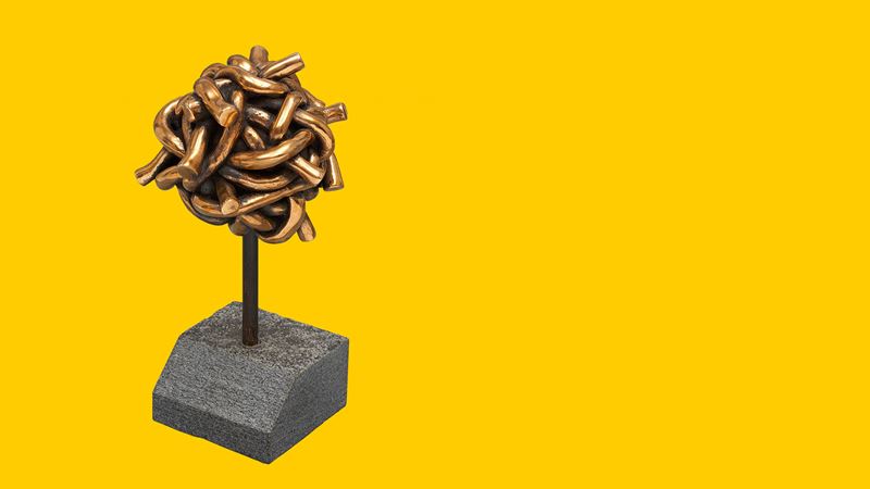 Die trophäe “Goldener Verkehrsknoten” mit einem gelben Hintergrund