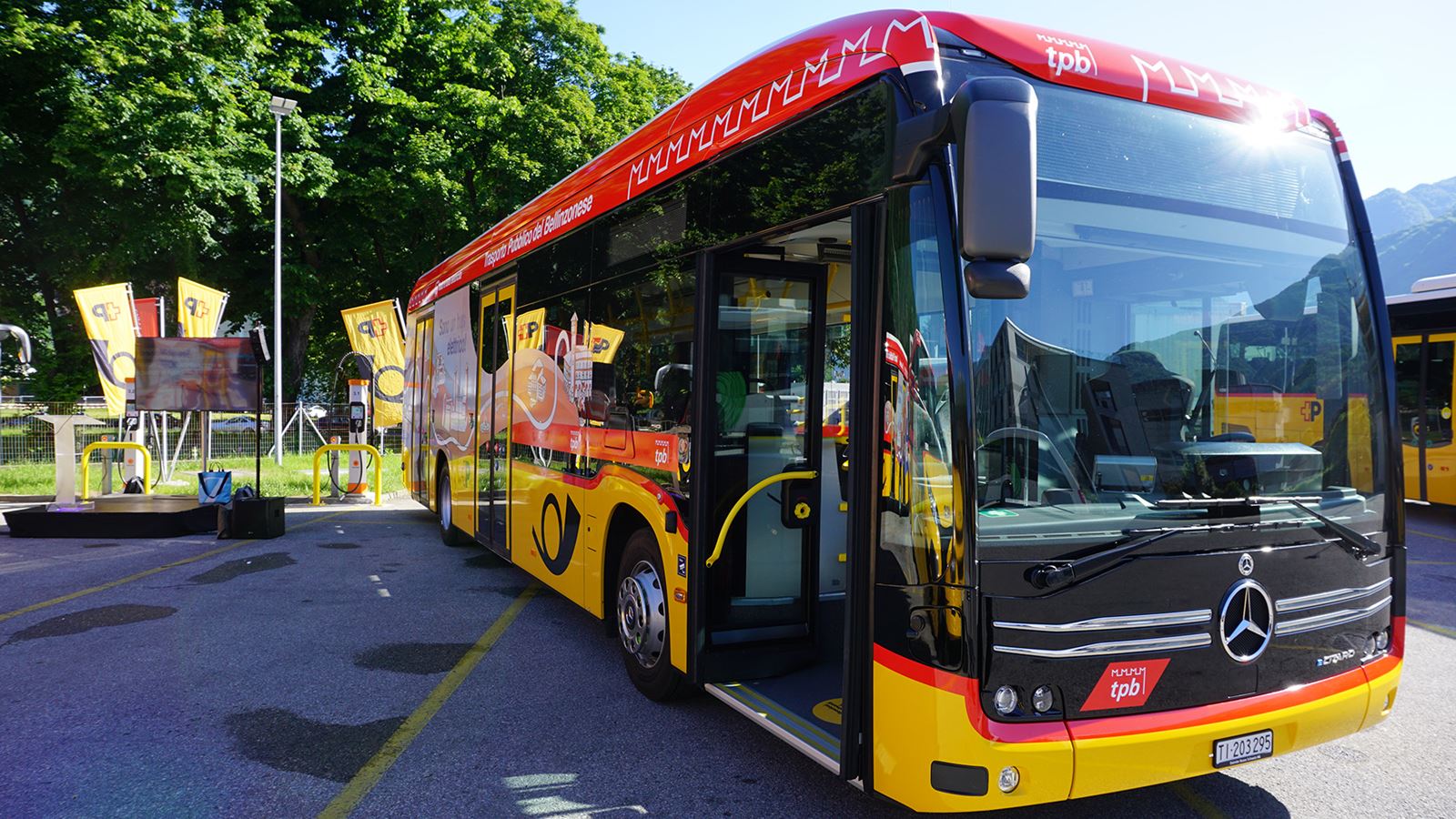 An electric Postbus is depicted on the side. The lettering “E-mobility, not emissions” must be read. 